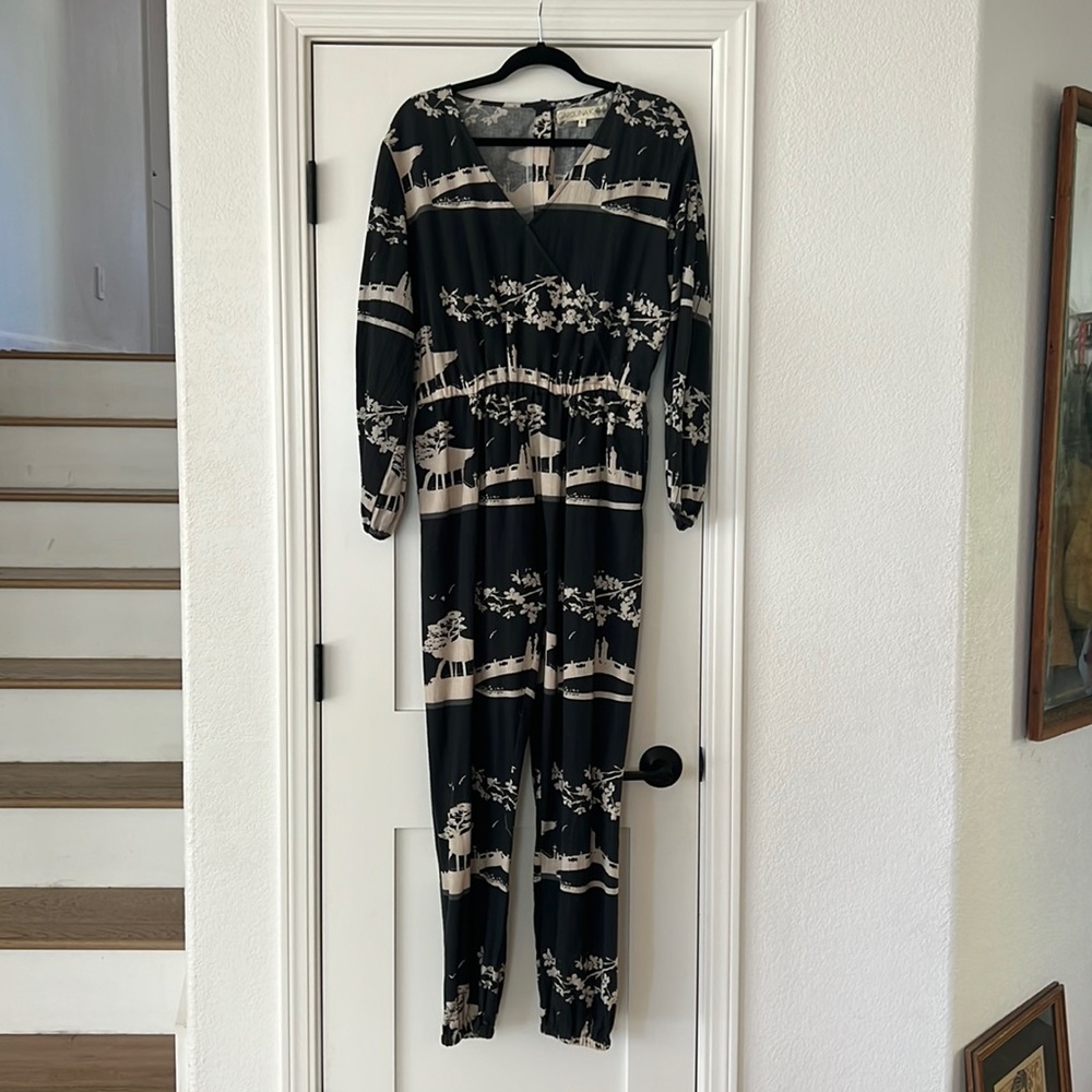 Carolina K linen jumpsuit with pockets and button-up back.